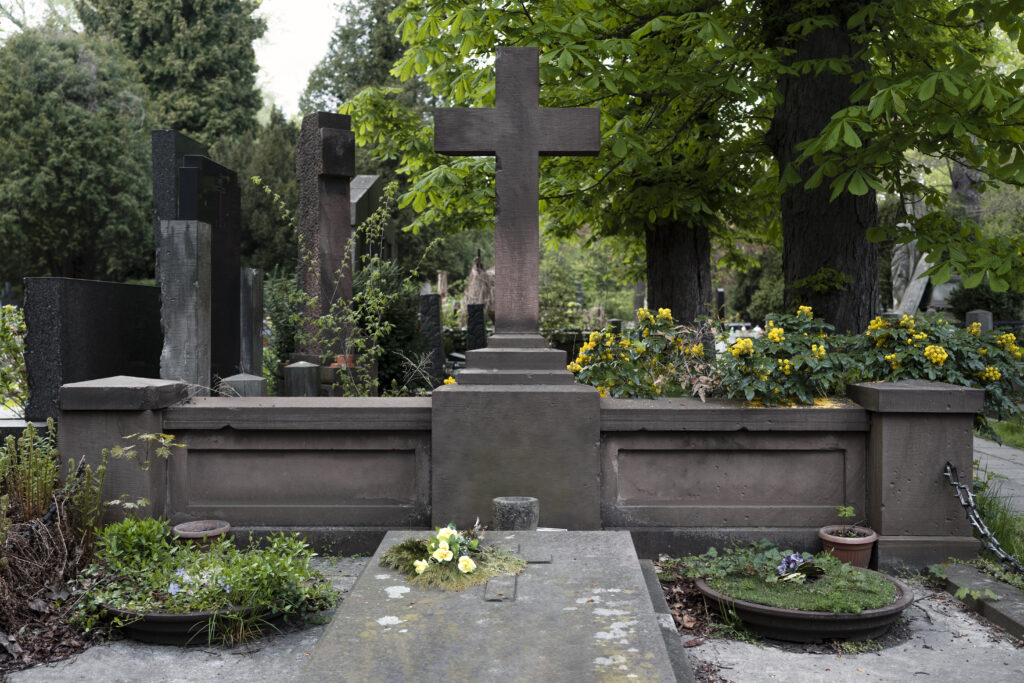 Custom-made granite grave stone with unique design elements.